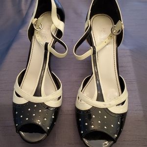 Black and white T-strap pumps